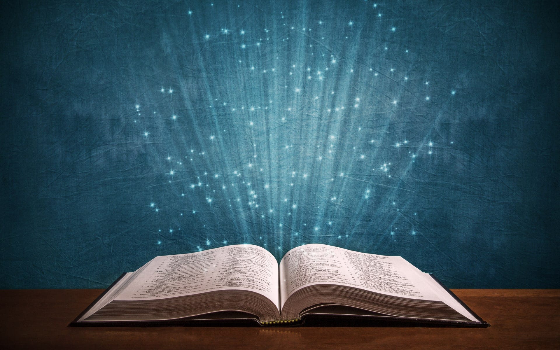 Bible with rays of light in the center - Integrity Syndicate - Love Truth Spirit affinitychurch.org